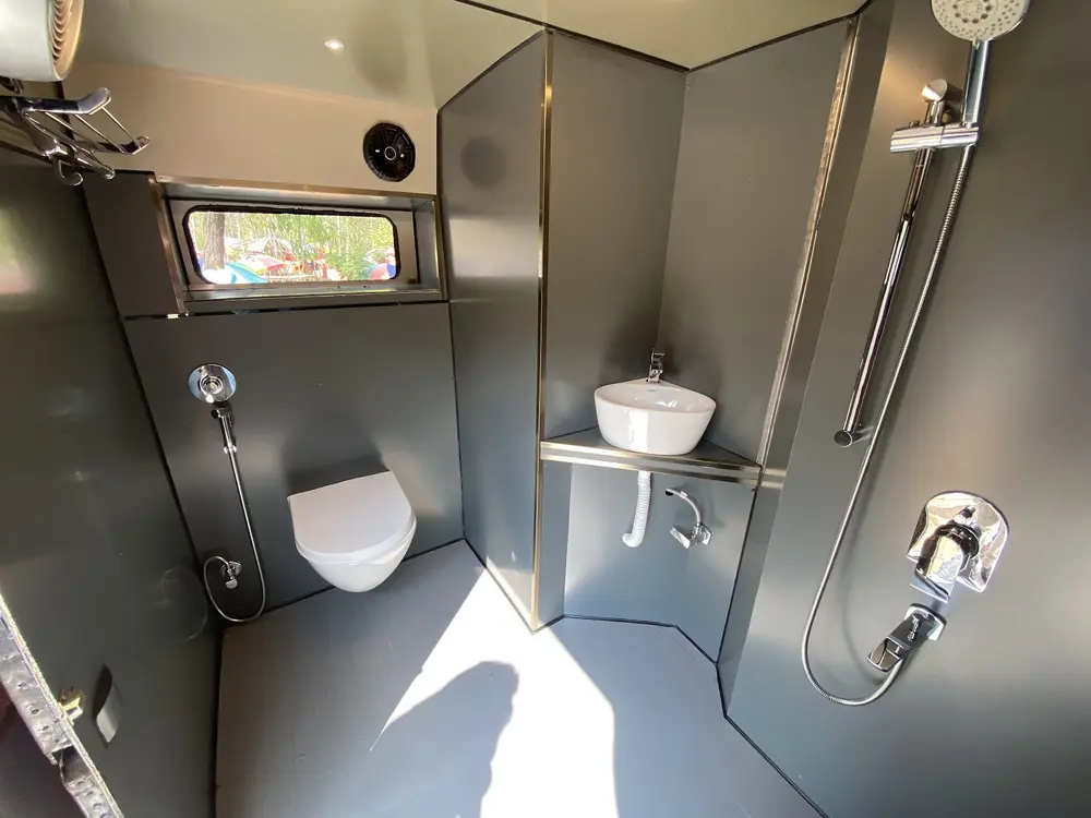 The accessible washroom and handwashing area inside the pilot bus